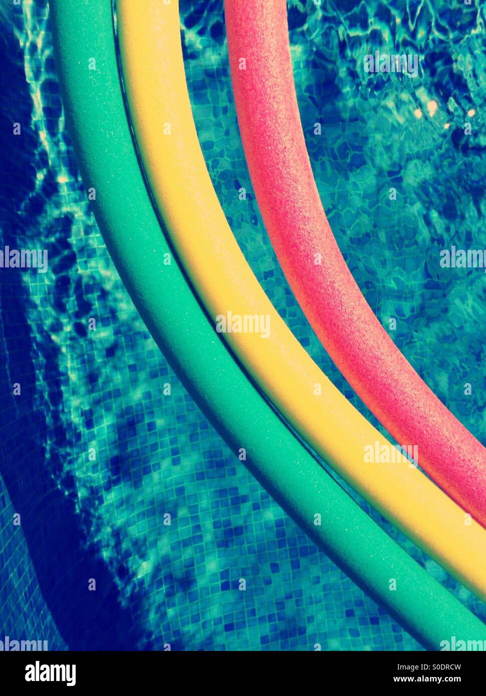 Three coloured floats in a swimming pool - Smartphone Captured Stock Image