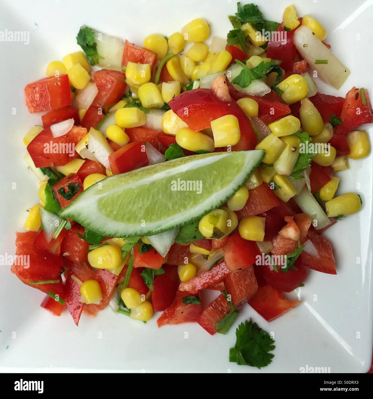corn and red bell pepper salsa Stock Photo