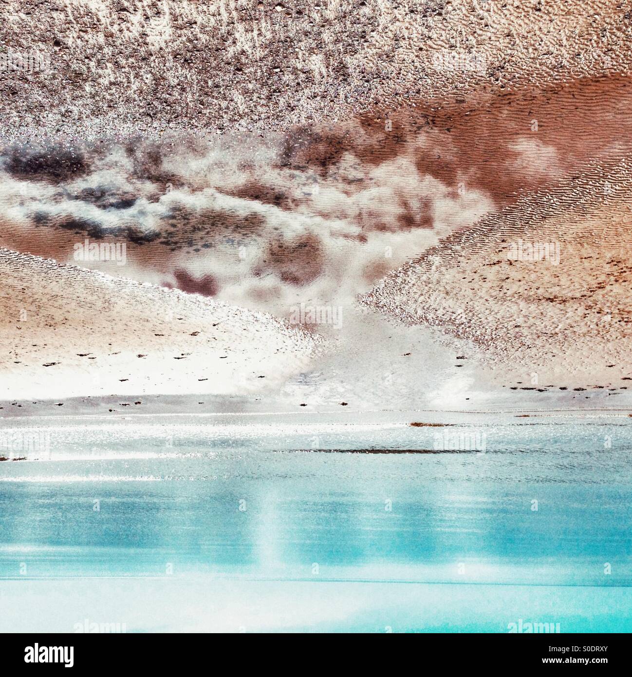 Cloudy reflection on beach - Smartphone Captured Stock Image