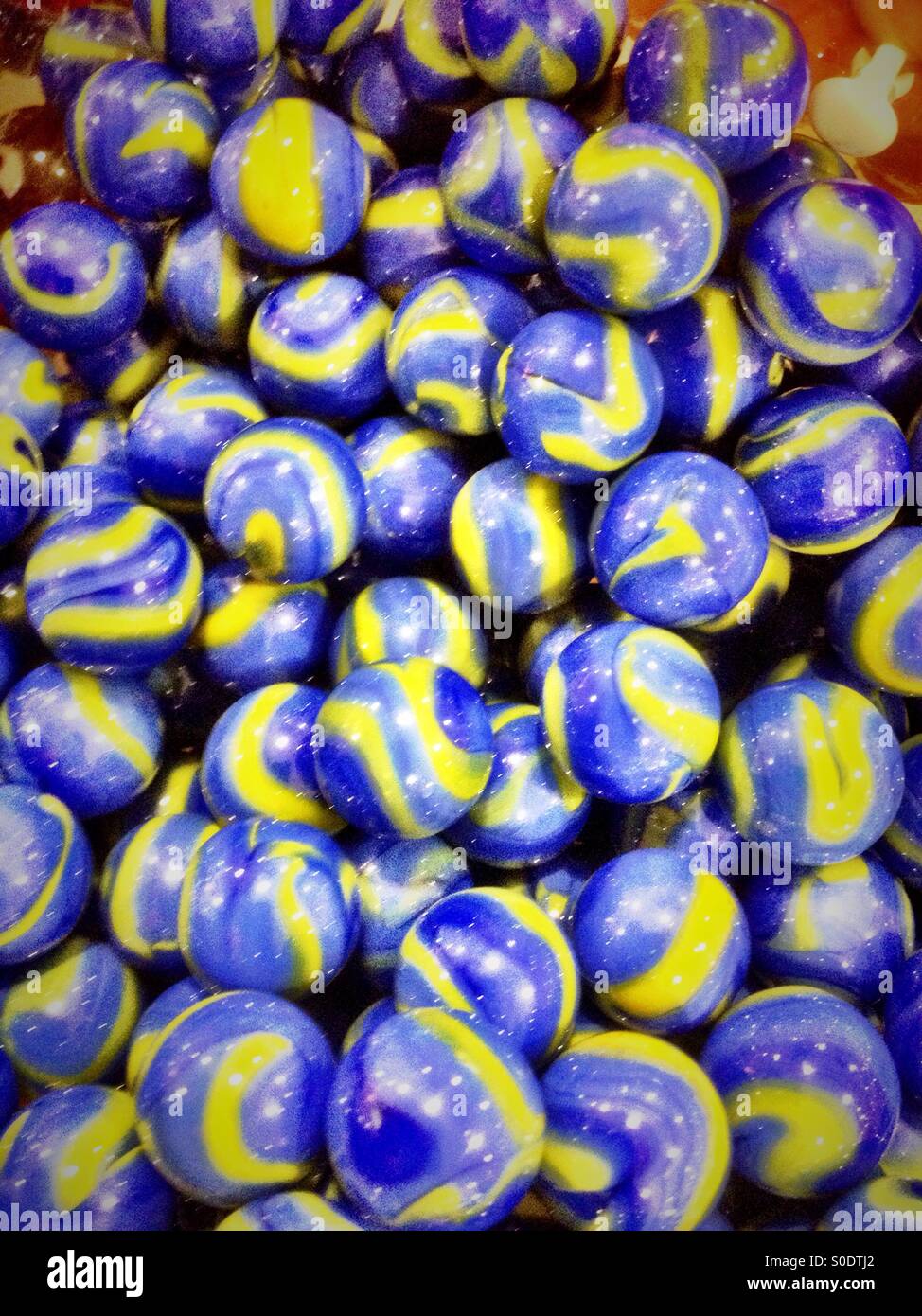 Blue and yellow marbles. - Smartphone Captured Stock Image