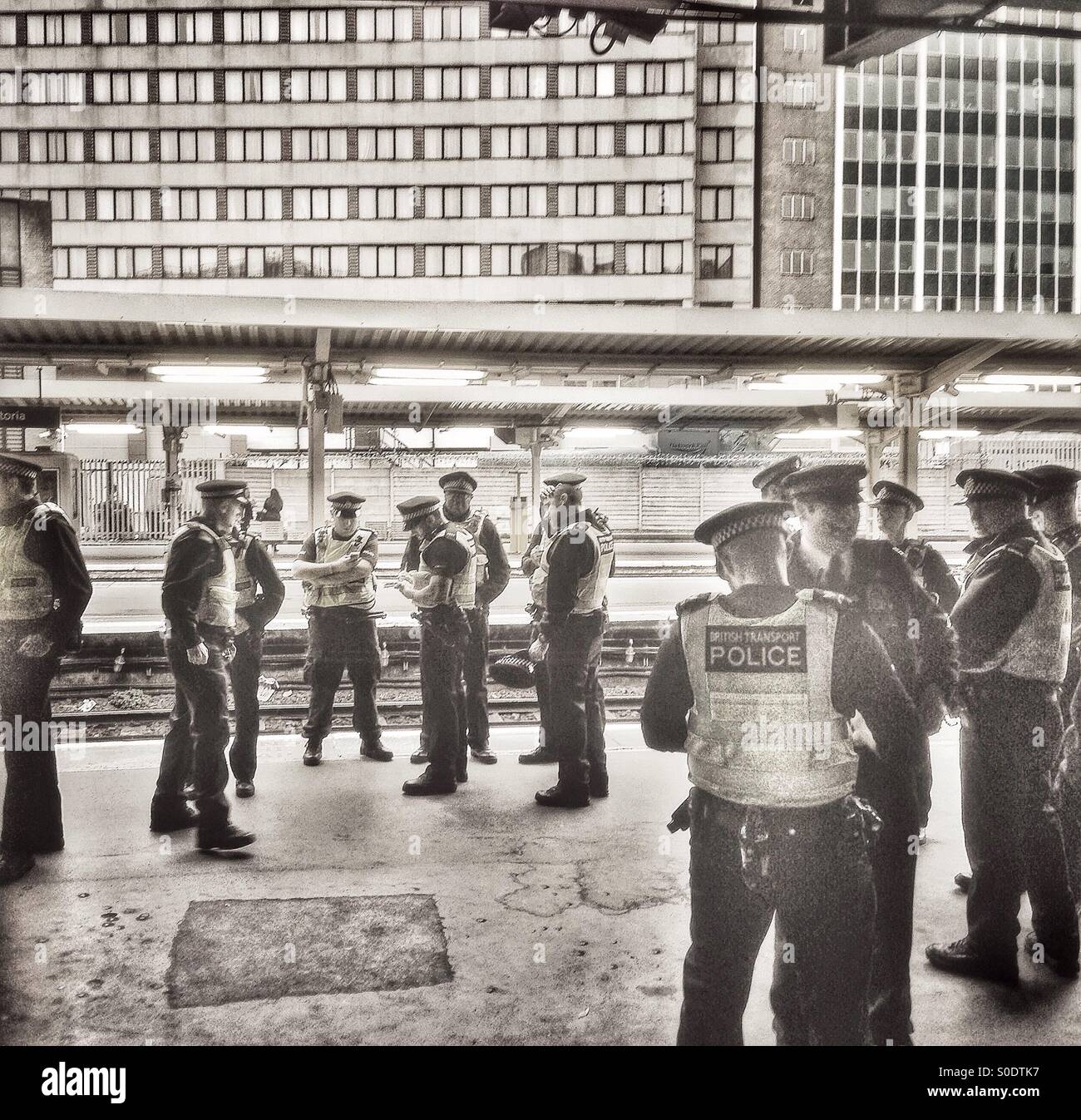 Metropolitan and British transport police on duty at Victoria station. - Smartphone Captured Stock Image