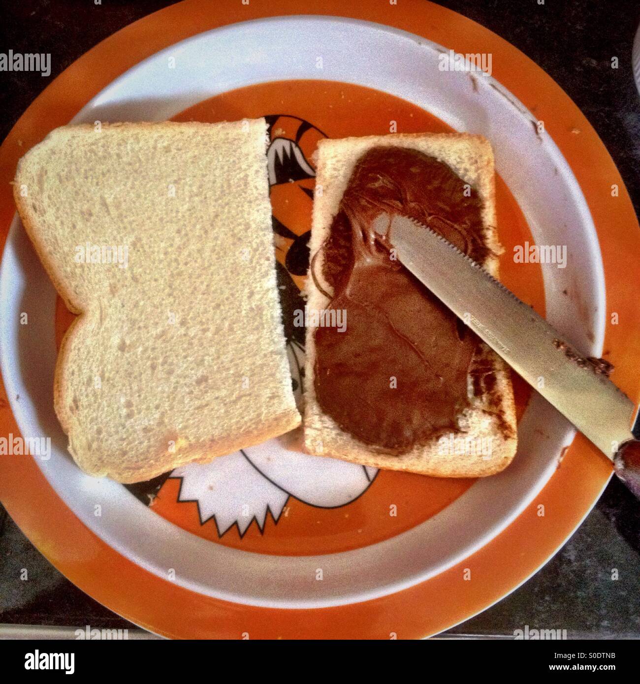 Making chocolate sandwiches. Stock Photo
