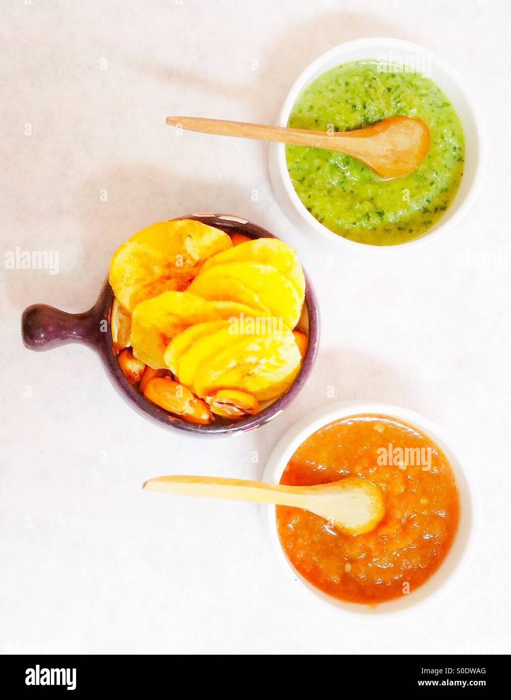 Red and Green Chile Salsas with Plantain Chips and Corn Nuts - Smartphone Captured Stock Image