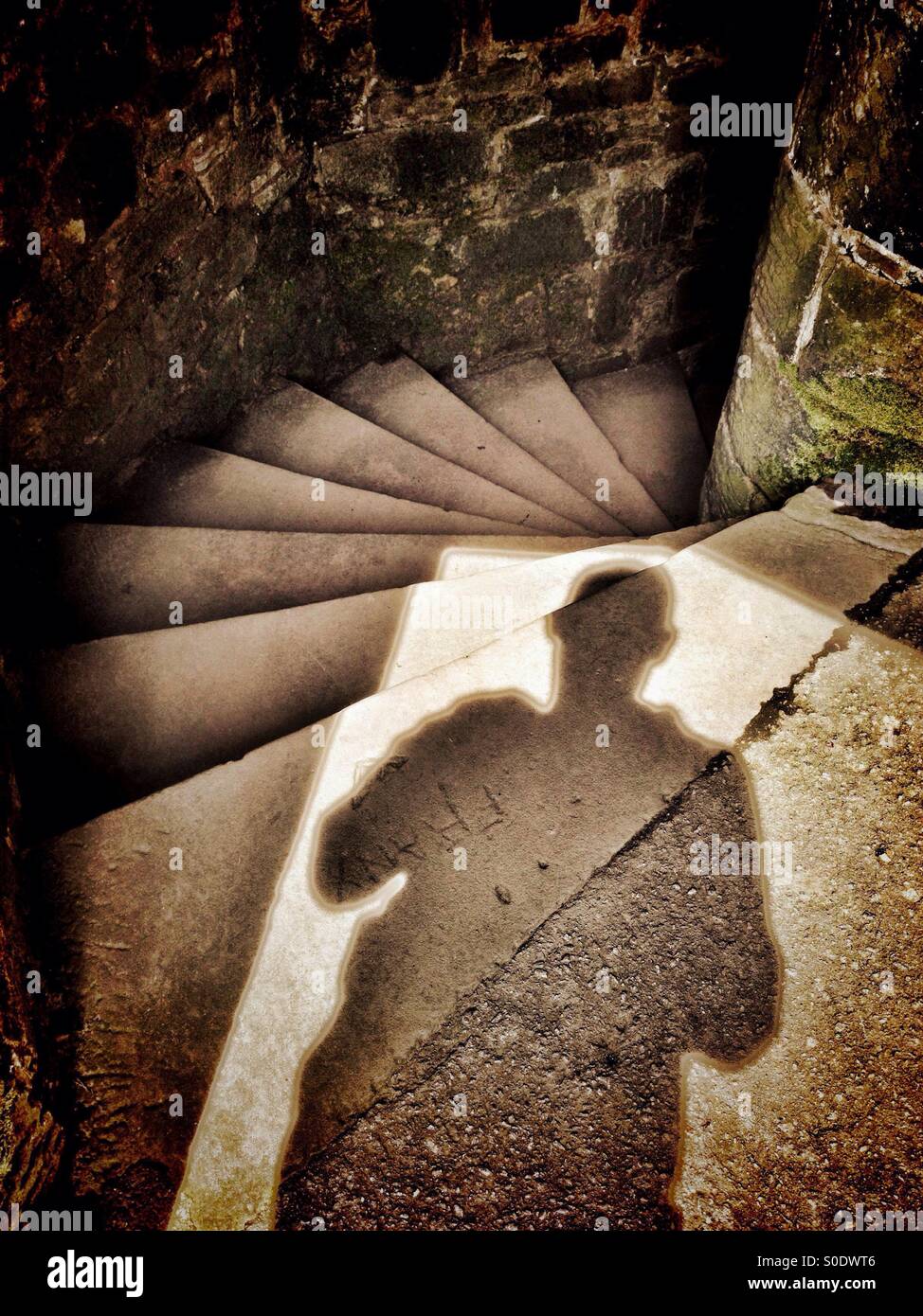 Mysterious shadow at top of stone spiral staircase (Darwen Tower, Blackburn) Stock Photo