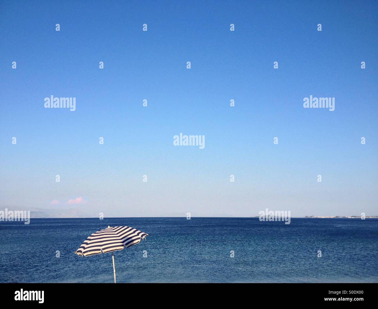 Parasol on Greek beach Stock Photo Alamy