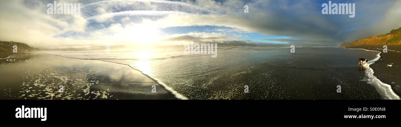 Stunning beach sunset panorama after a storm - Smartphone Captured Stock Image