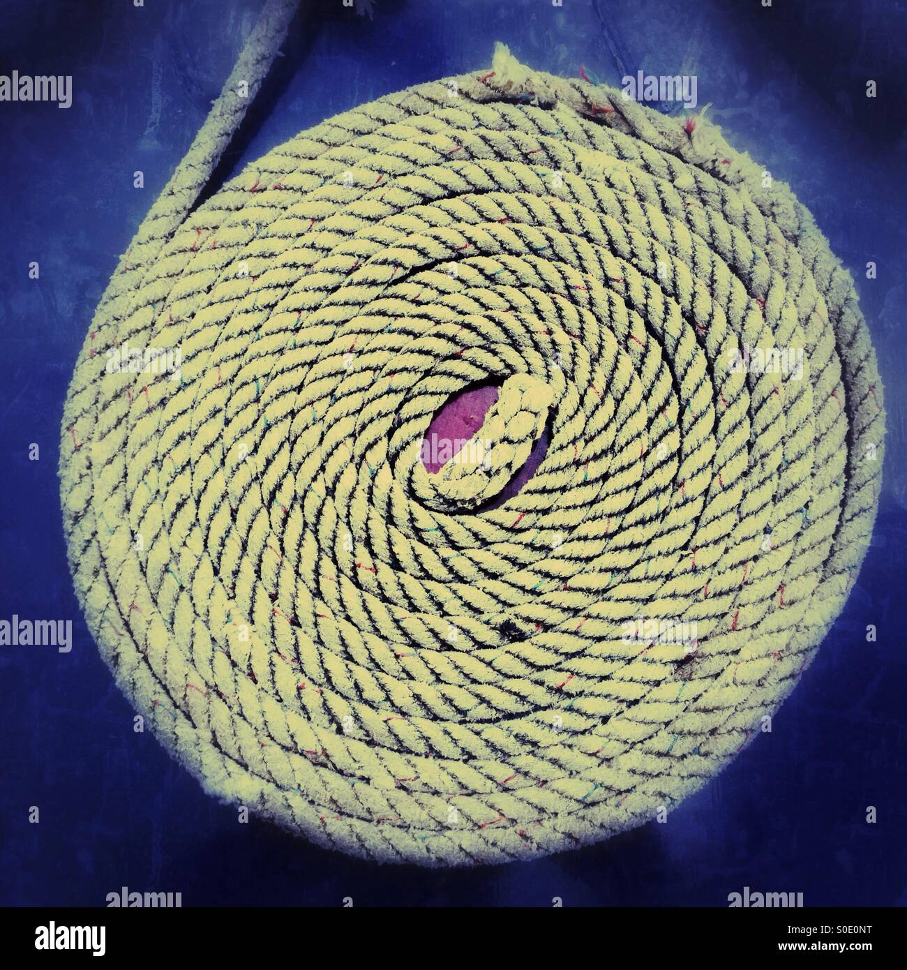 Coiled rope on a narrowboat. Grand Union Canal, Warwickshire, England. - Smartphone Captured Stock Image