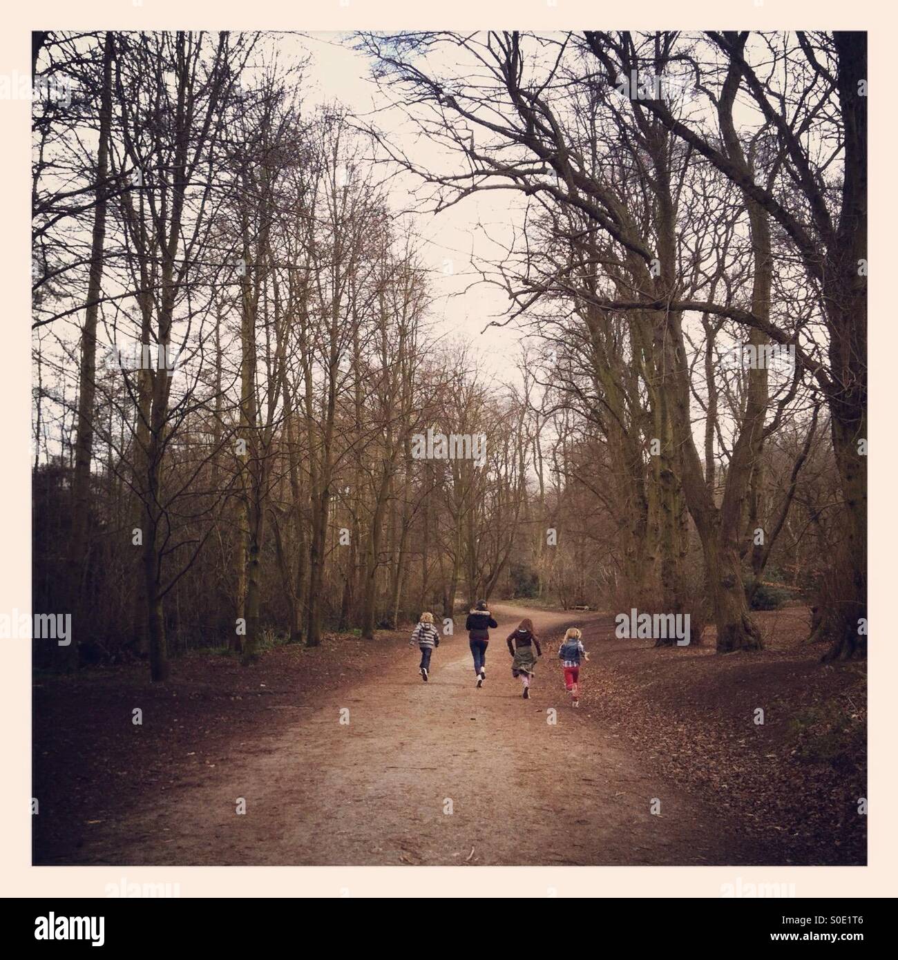 Kids running away Stock Photo - Alamy