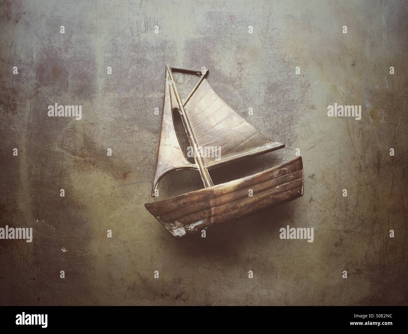 Old metal sailing boat model Stock Photo