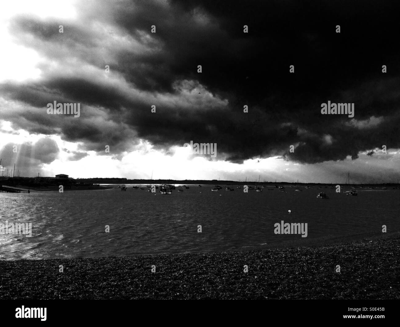 Rain clouds blowing up the river Deben at Felixstowe Ferry, Suffolk, England. - Smartphone Captured Stock Image
