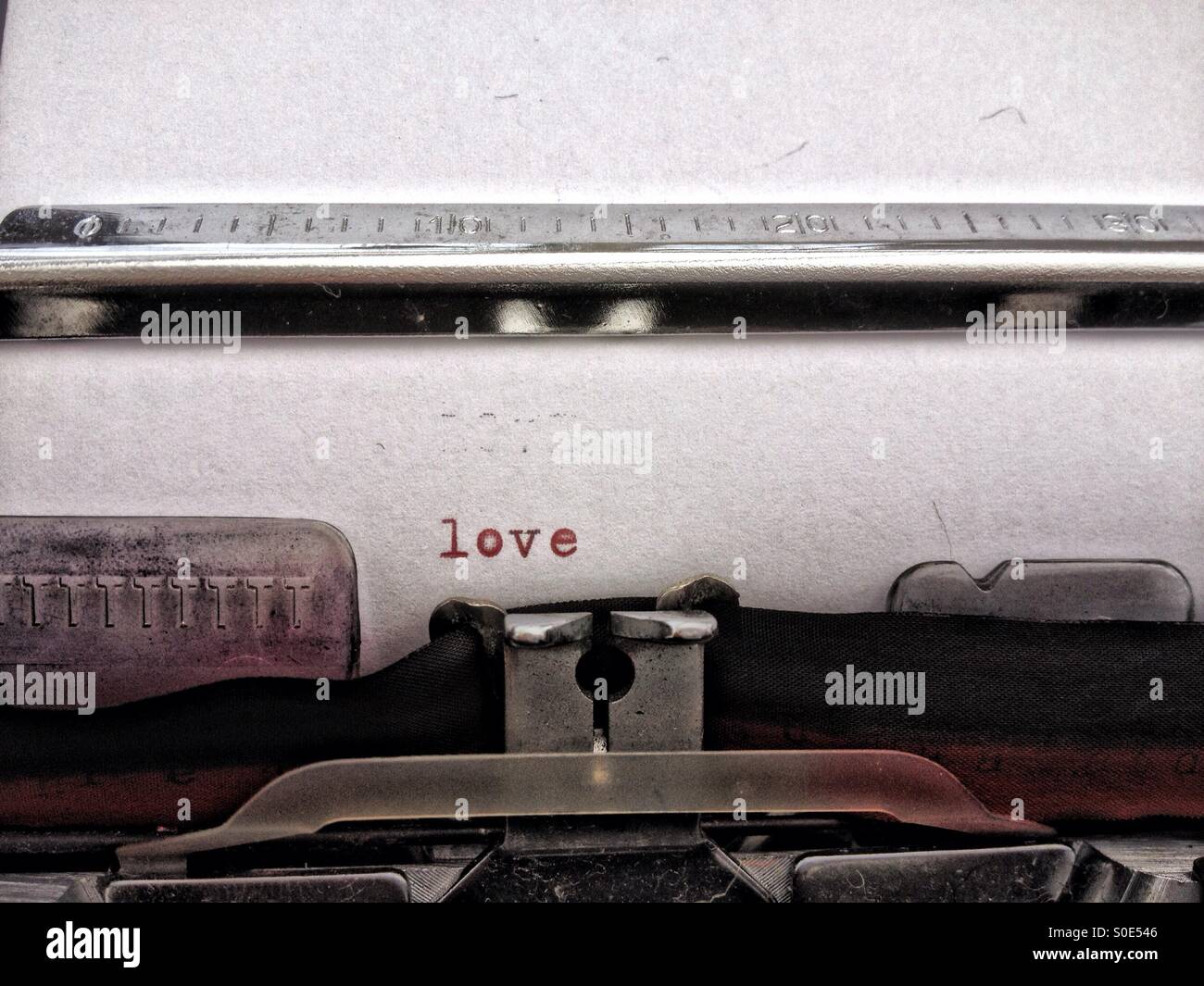 Love typed on a typewriter - Smartphone Captured Stock Image