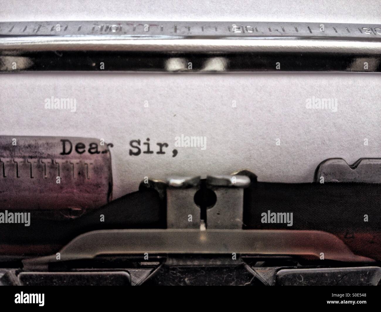 Dear sir typed on a typewriter Stock Photo