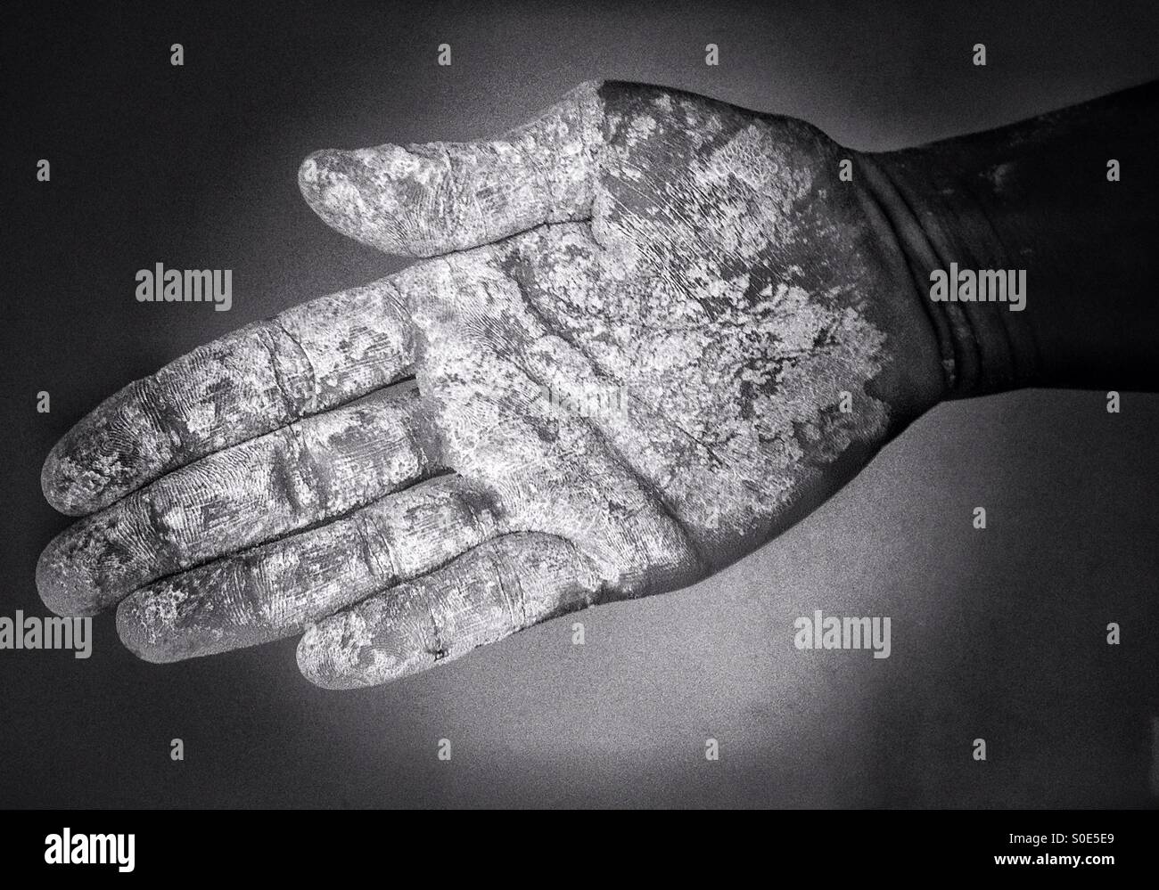 Closed hand with gluten free flour - Smartphone Captured Stock Image