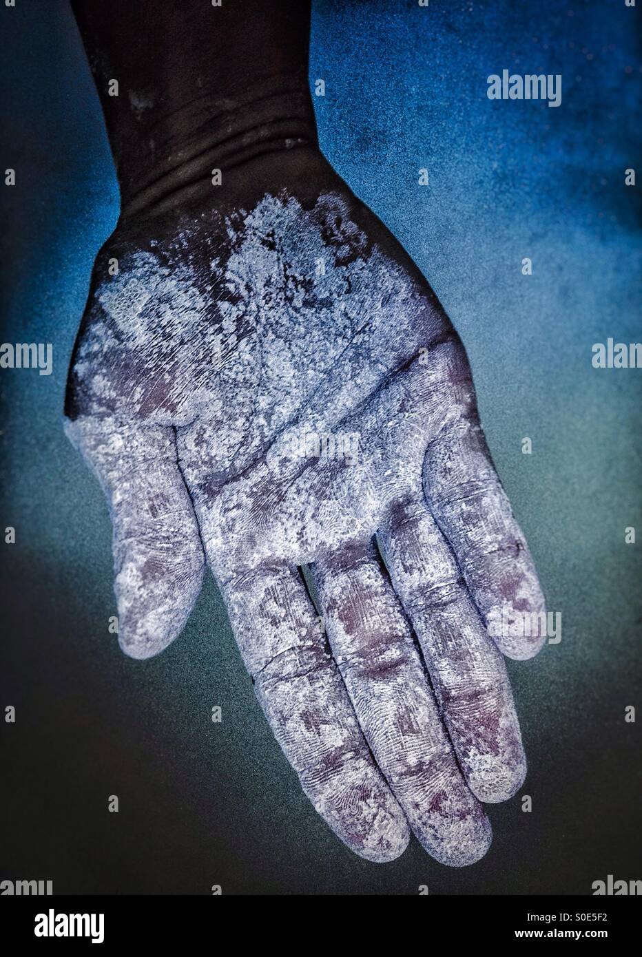 Colorful closed hand dirty with gluten free flour - Smartphone Captured Stock Image