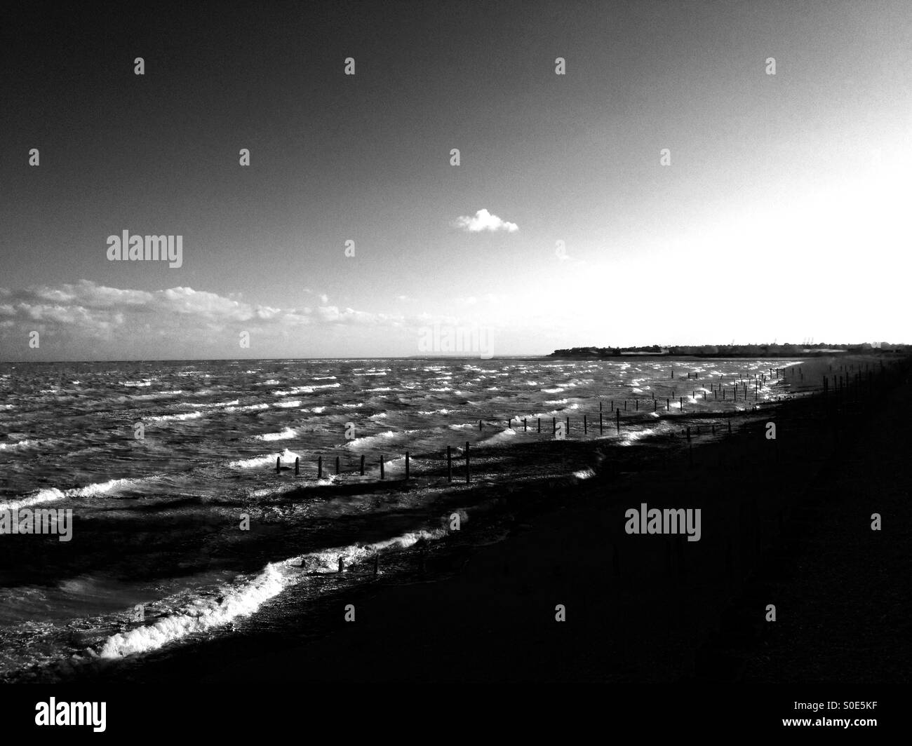 Offshore winds blowing in large waves onto the beach at Bawdsey Ferry, Suffolk, UK. - Smartphone Captured Stock Image