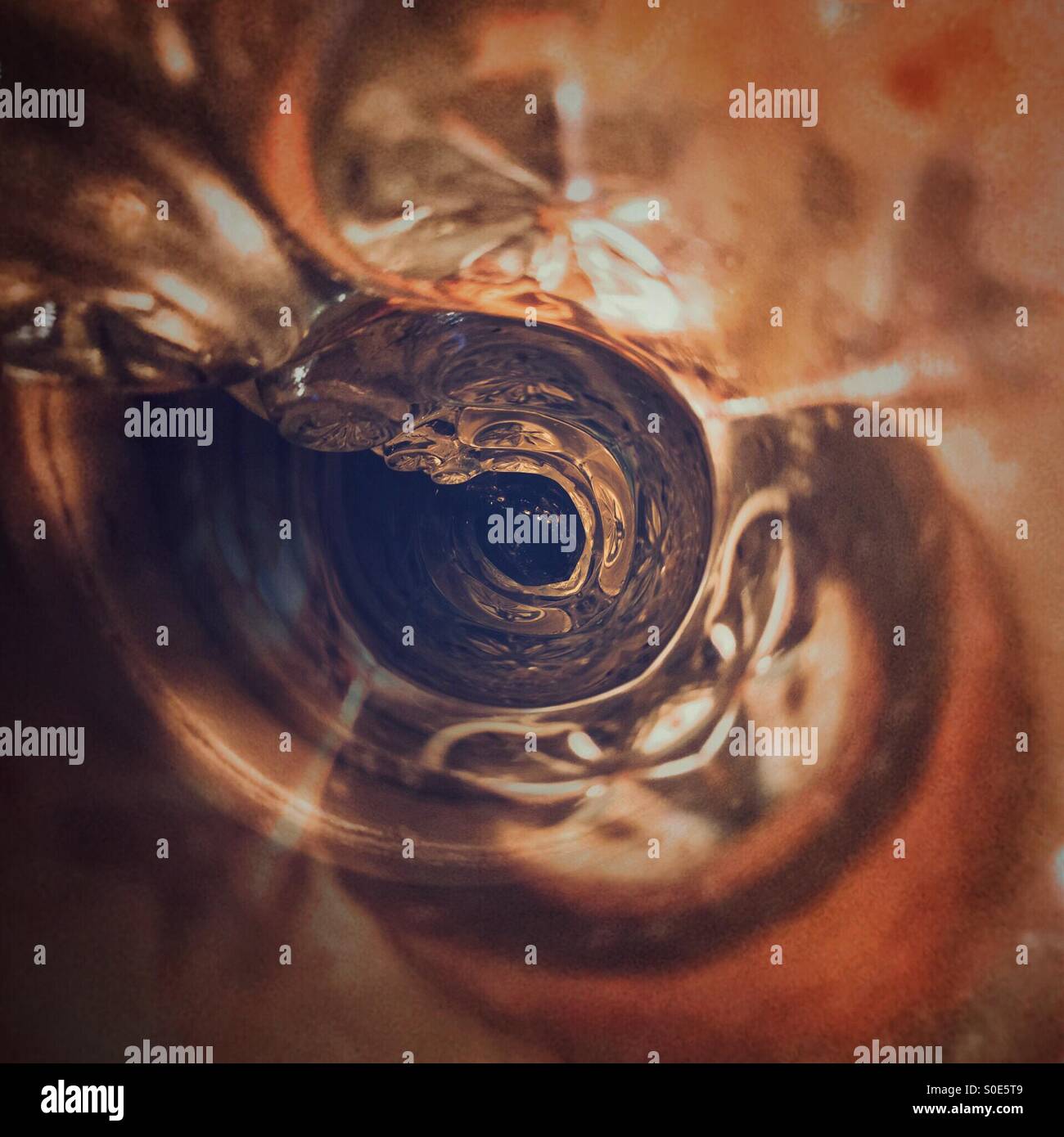 Into a glass hole Stock Photo Alamy