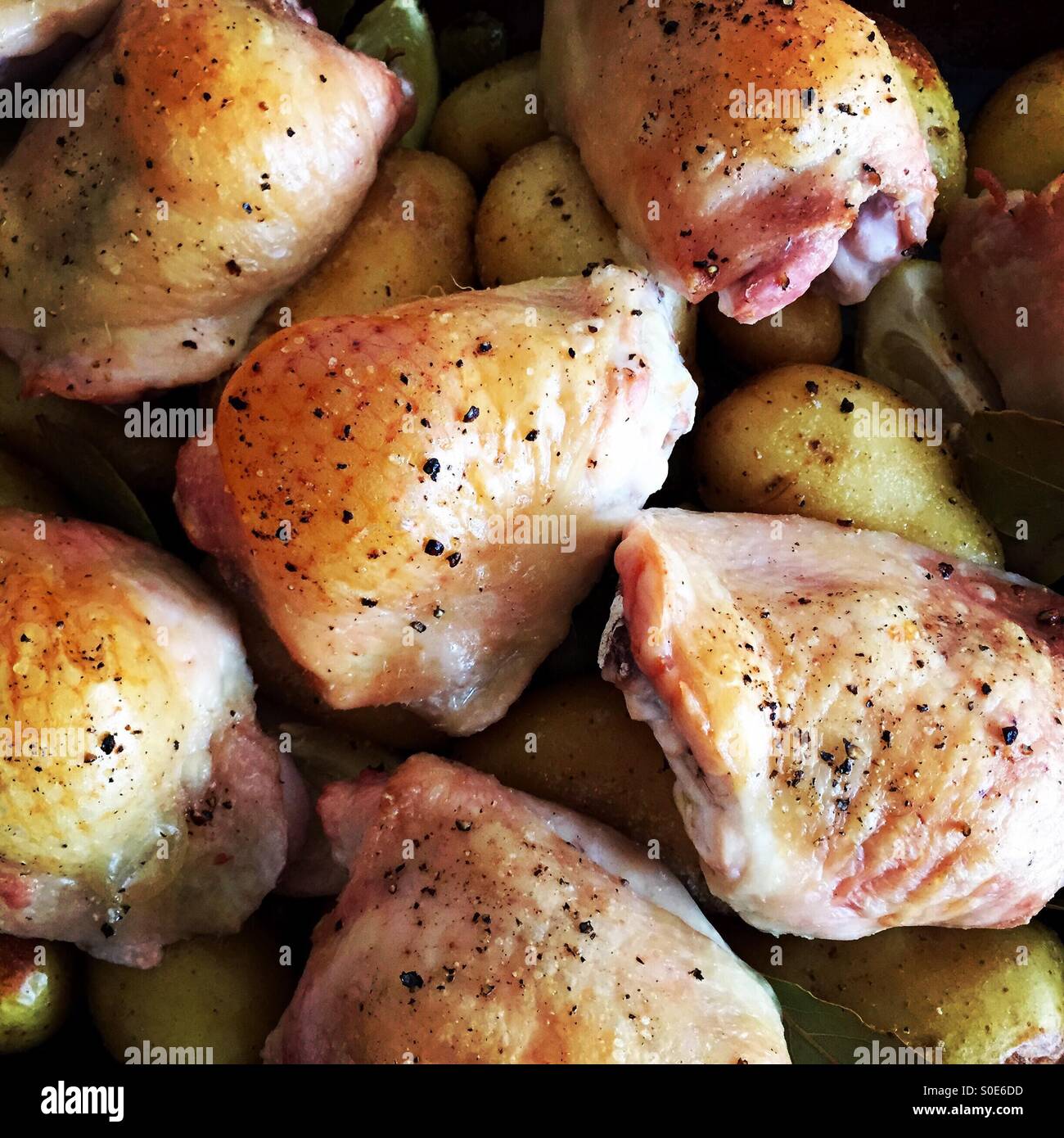 Chicken & new potato tray bake Stock Photo - Alamy