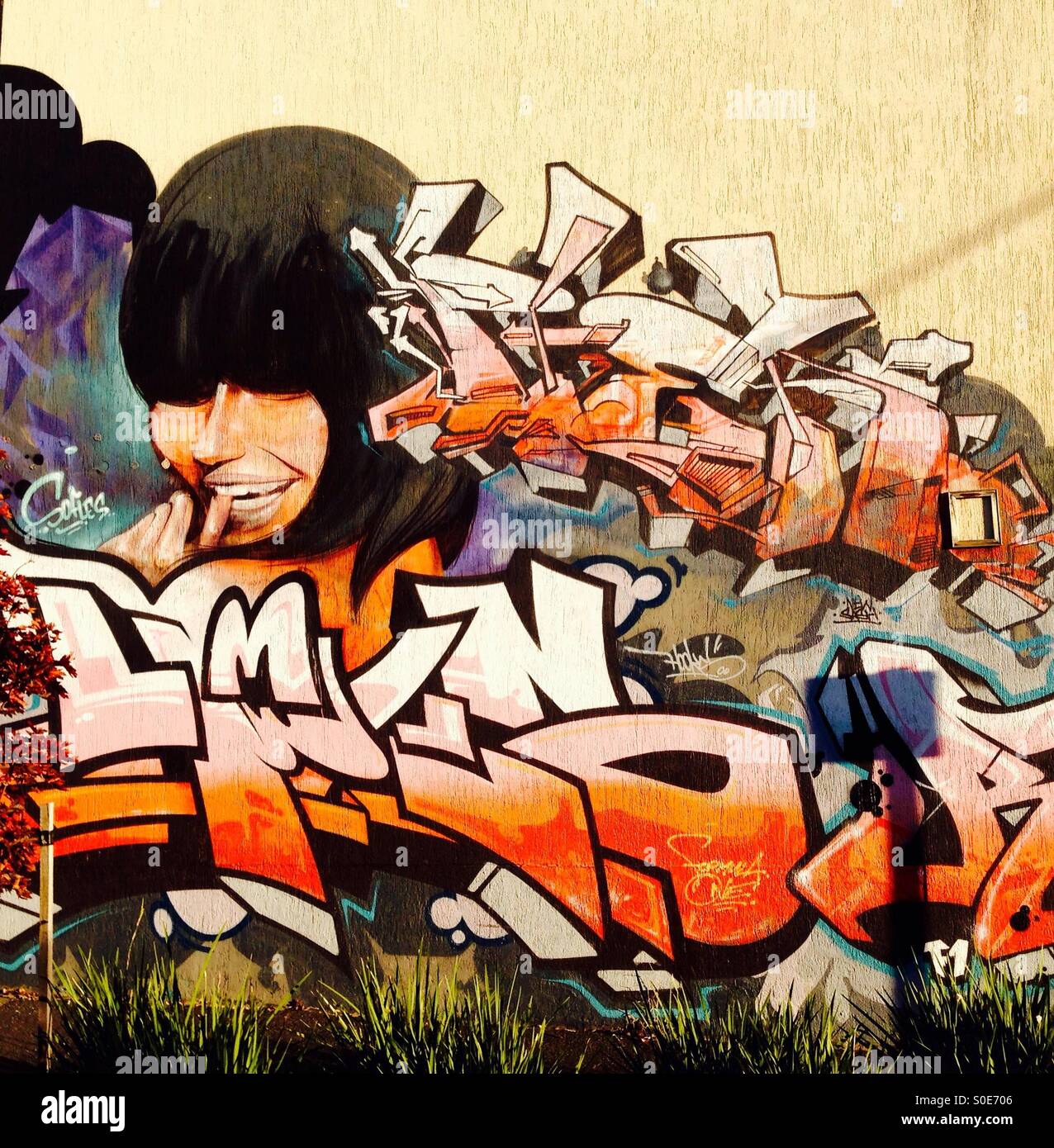 Street art of girl & graffiti Stock Photo