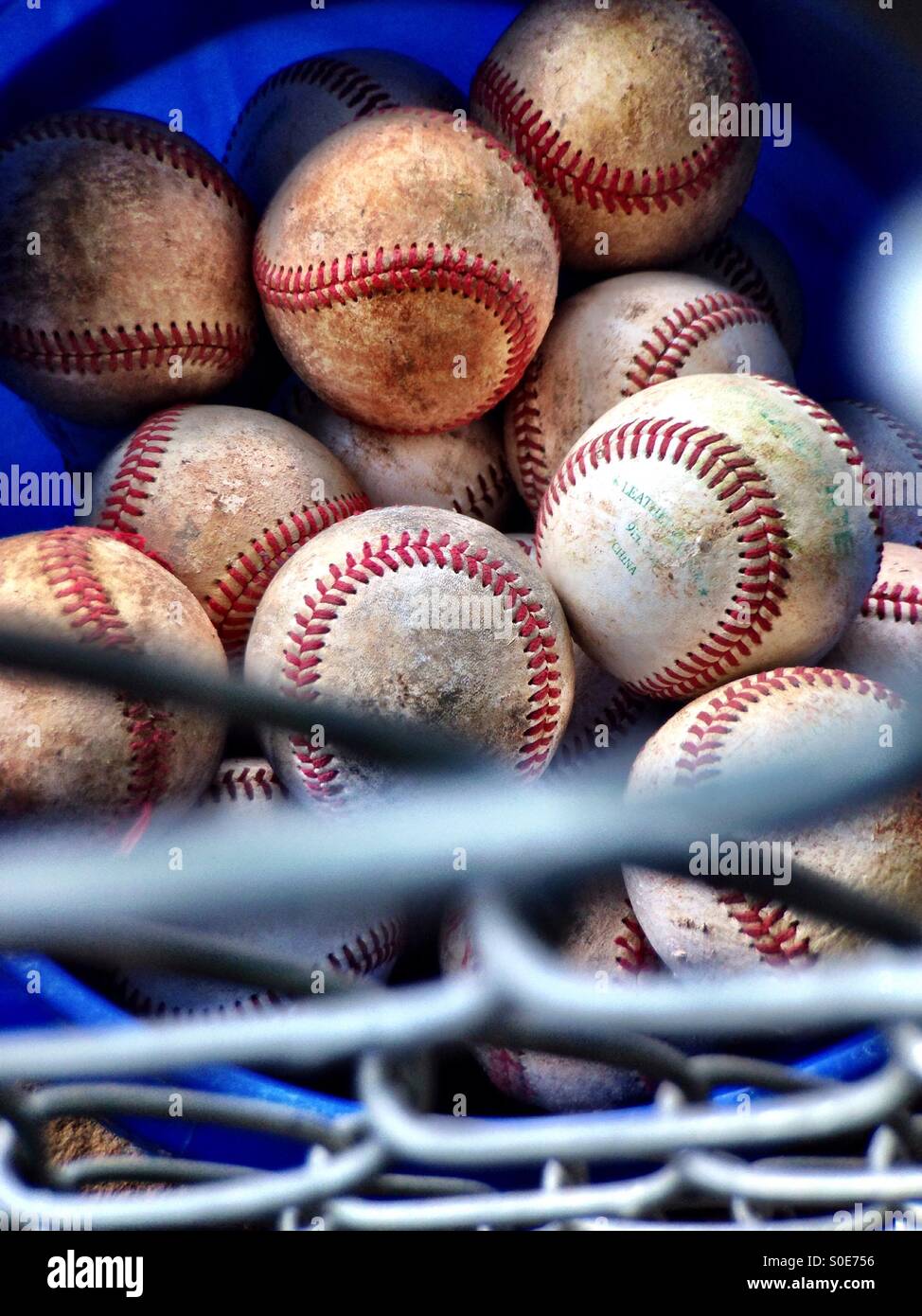 Bucket of baseballs inside the dugout Stock Photo Alamy