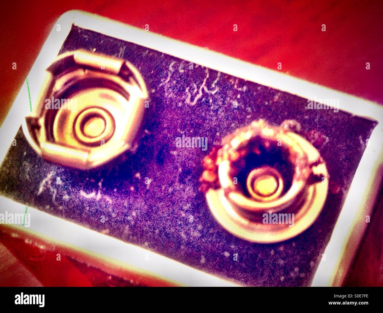 Close up of the terminals of a battery that has leaked slightly. - Smartphone Captured Stock Image