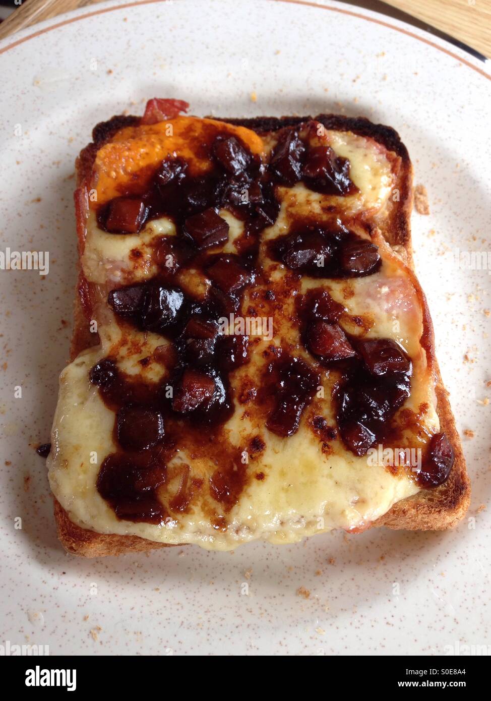 Cheese on toast with Branston Pickle. Stock Photo