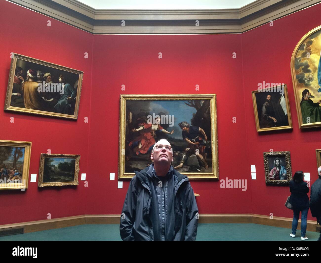 Man looking at art, National Gallery of Scotland, Edinburgh Stock Photo