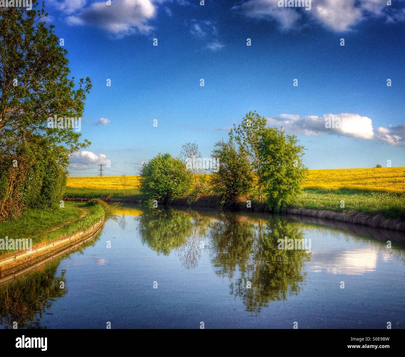 Evening reflections on the Grand Union Canal at Nether Heyford, Northamptonshire, England. Stock Photo