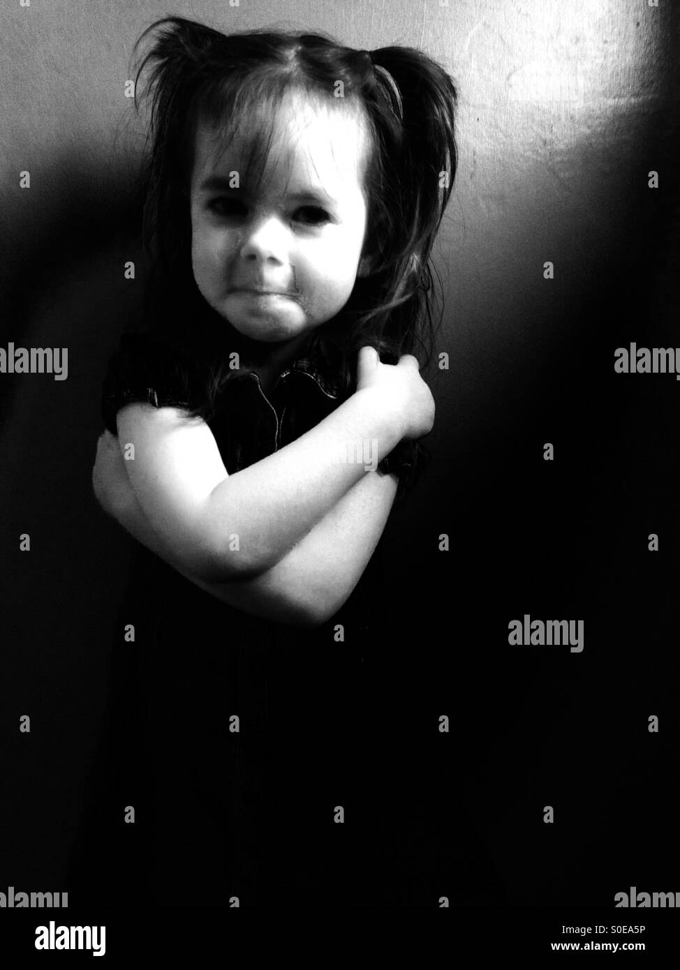 3-year old girl with pigtails in her hair - Smartphone Captured Stock Image