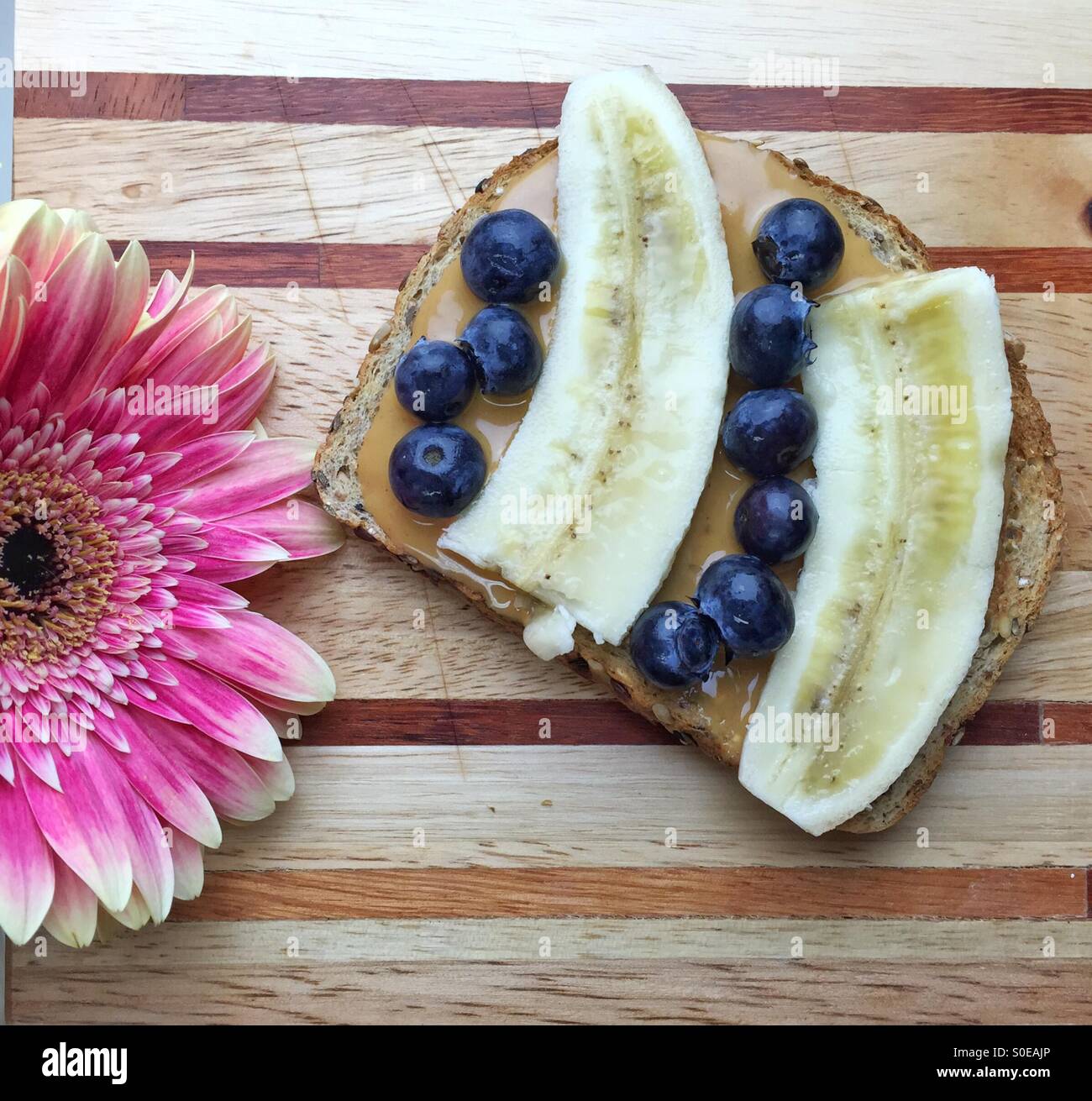 vegan breakfast whole wheat bread with peanut butter, bananas and