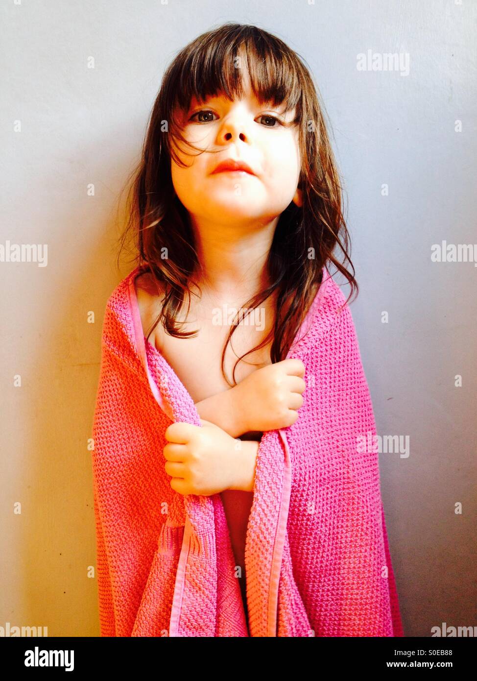 3year old girl wrapped in towel after bath Stock Photo Alamy
