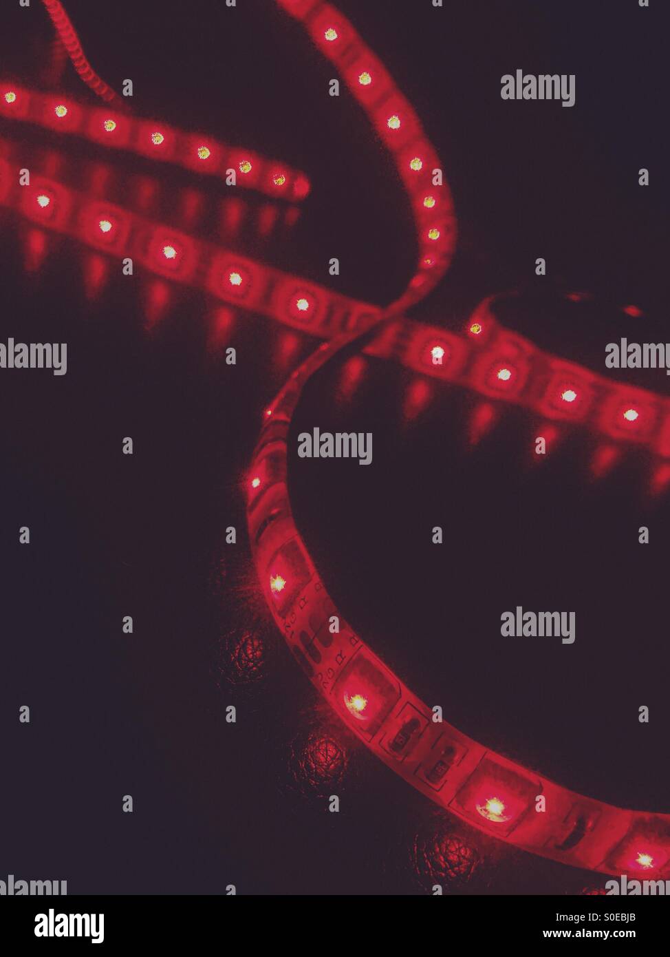 Red lights in a dark room Stock Photo Alamy