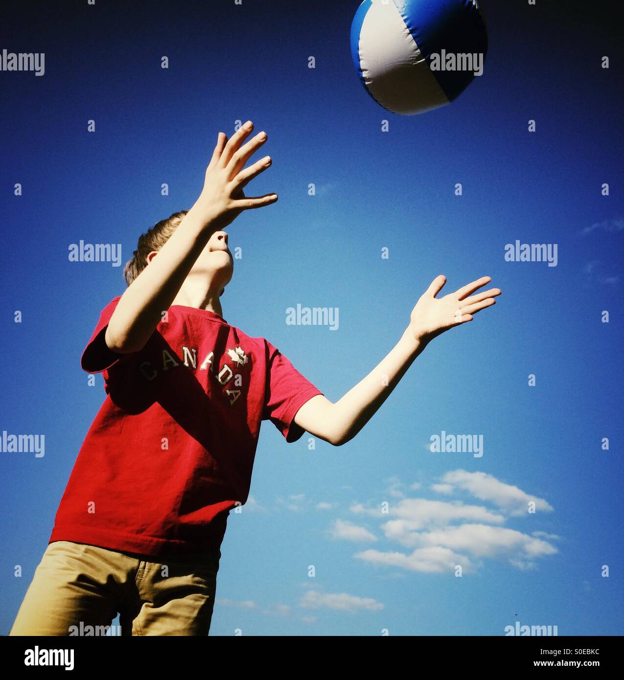 Child catching ball hires stock photography and images Alamy