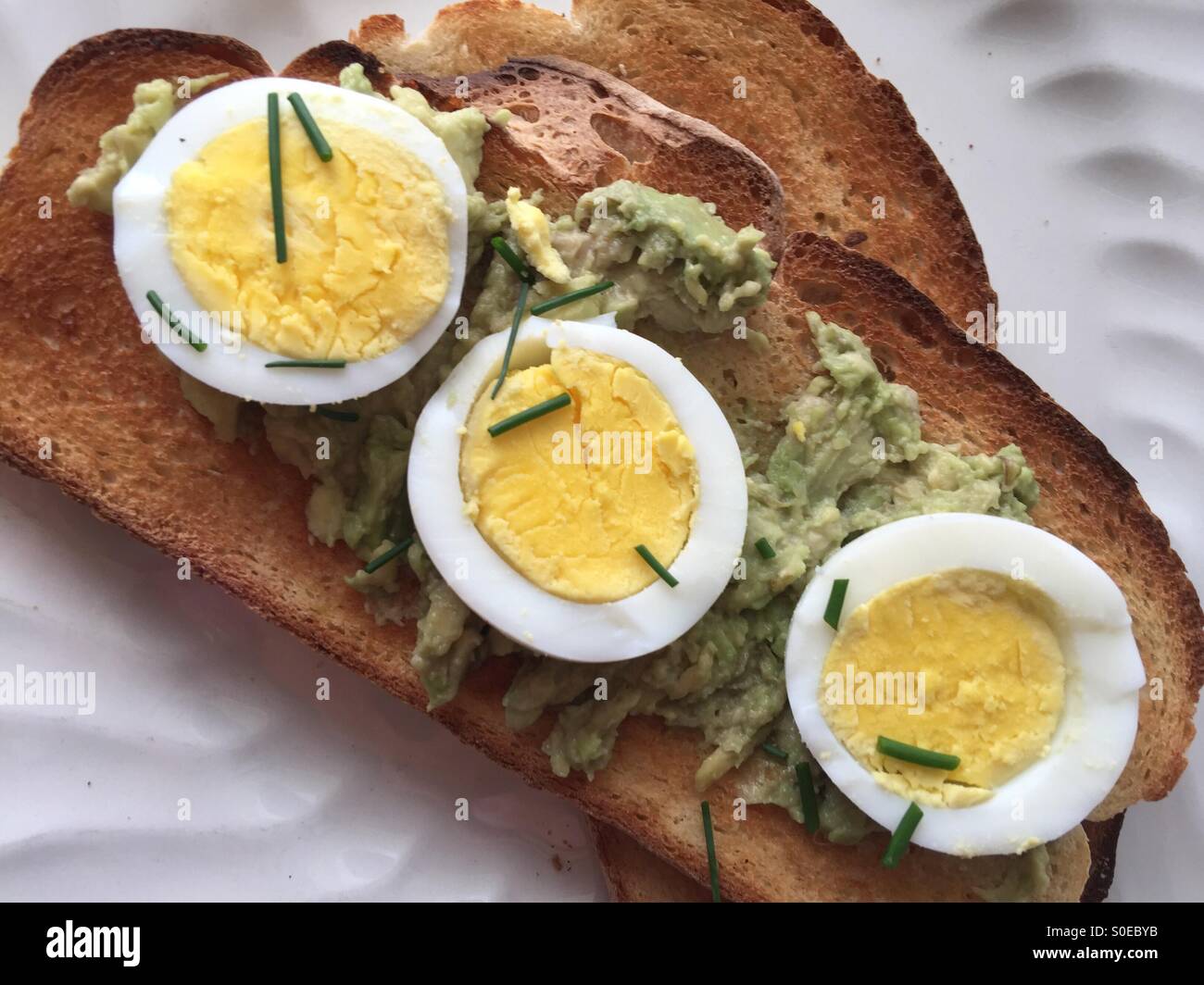 Avocado toast with boiled egg - Smartphone Captured Stock Image