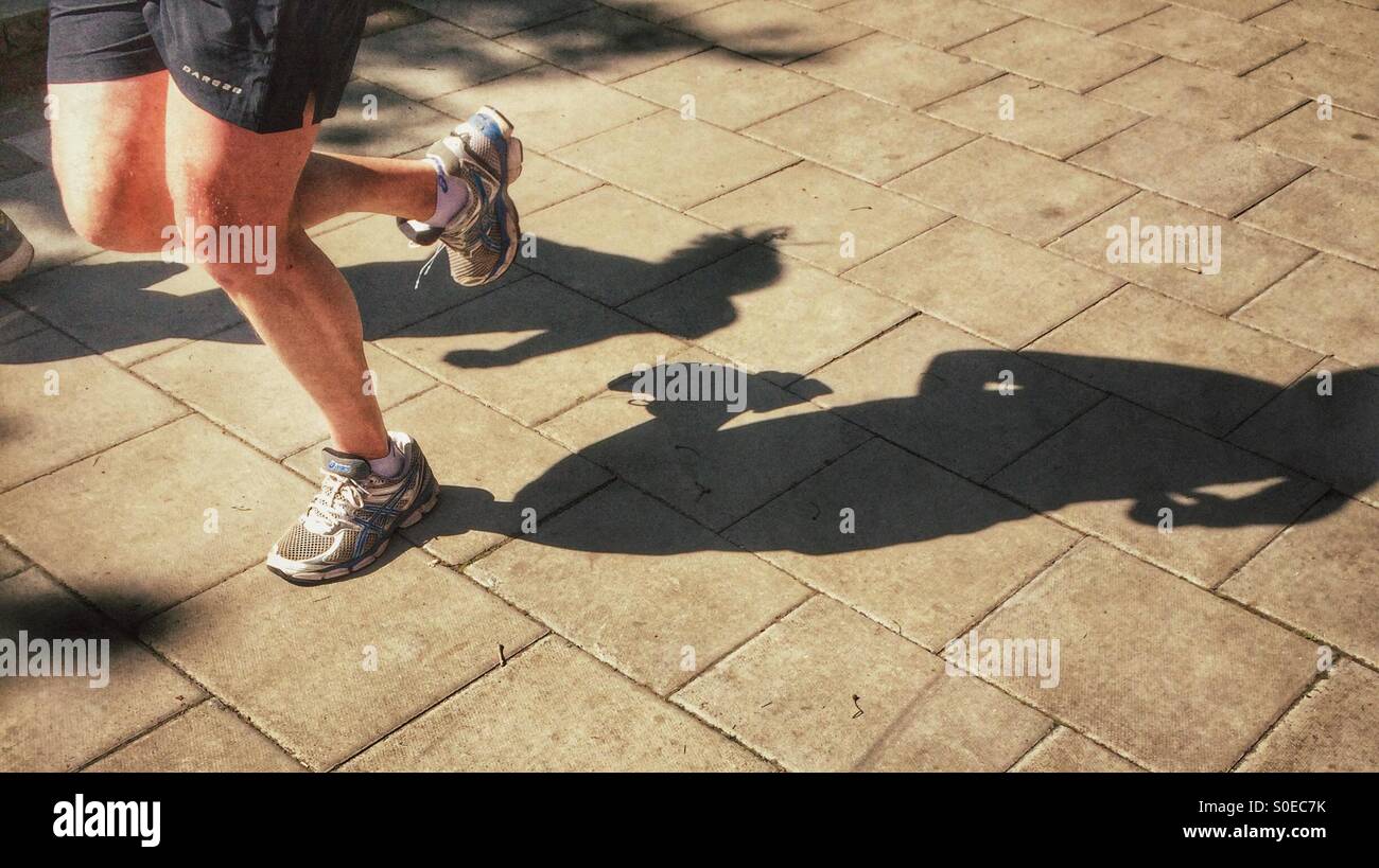 Shadow of a runner on the street - Smartphone Captured Stock Image