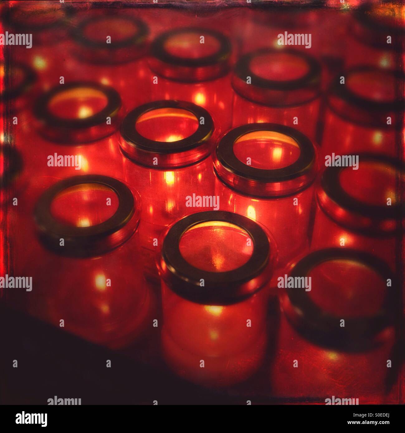 Lit Christian prayer candles in a church Stock Photo Alamy