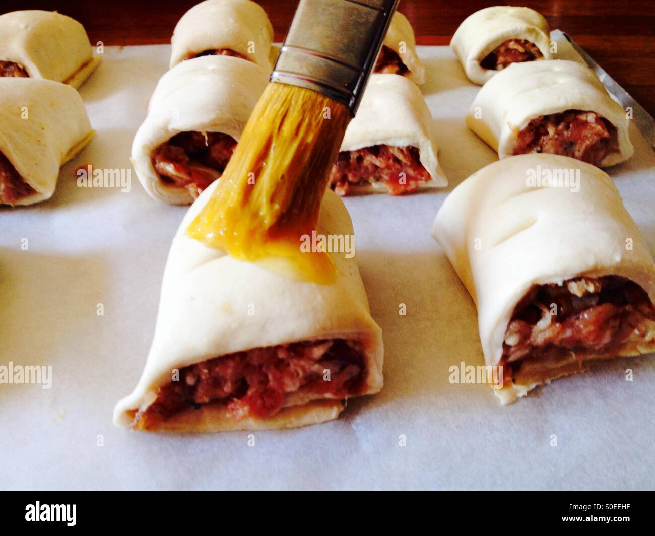 Homemade sausage rolls brushed with an egg glaze - Smartphone Captured Stock Image