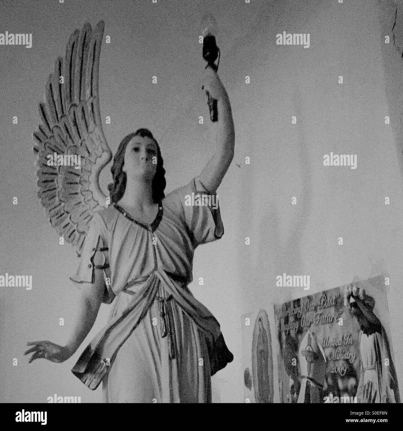 Angel in dark church Stock Photo Alamy
