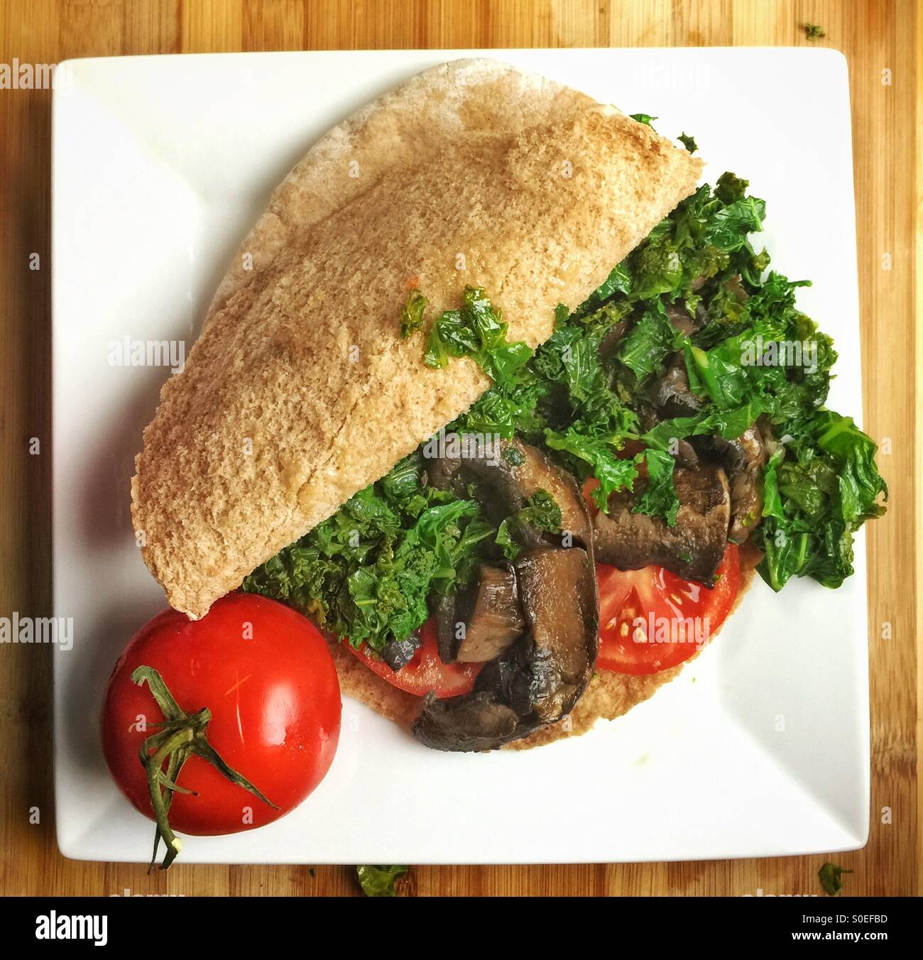 Vegan pita sandwich with mushrooms and kale - Smartphone Captured Stock Image