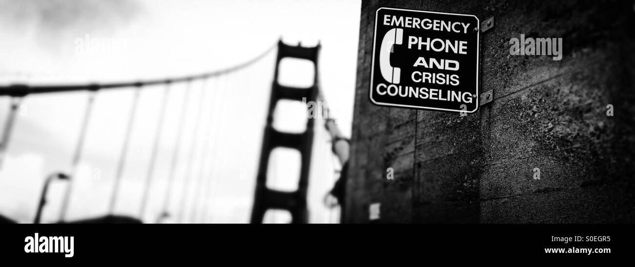 Emergency Phone and Crisis Counseling Sign on the Golden Gate Bridge. San Francisco, California, USA - Smartphone Captured Stock Image