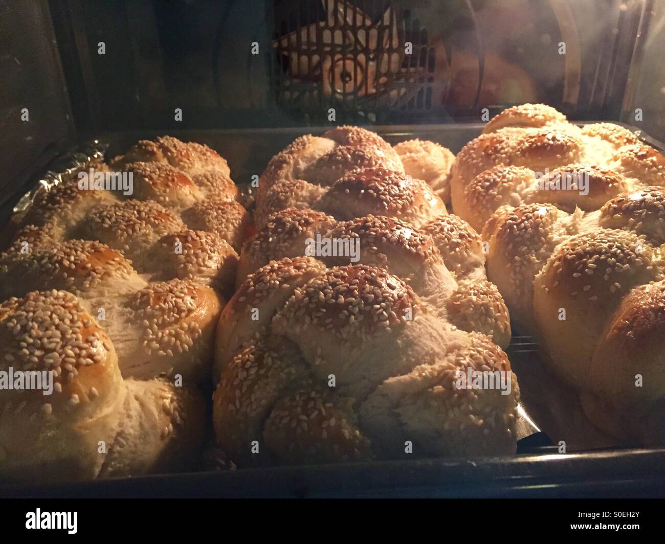 Challah bread baking in the oven Stock Photo Alamy