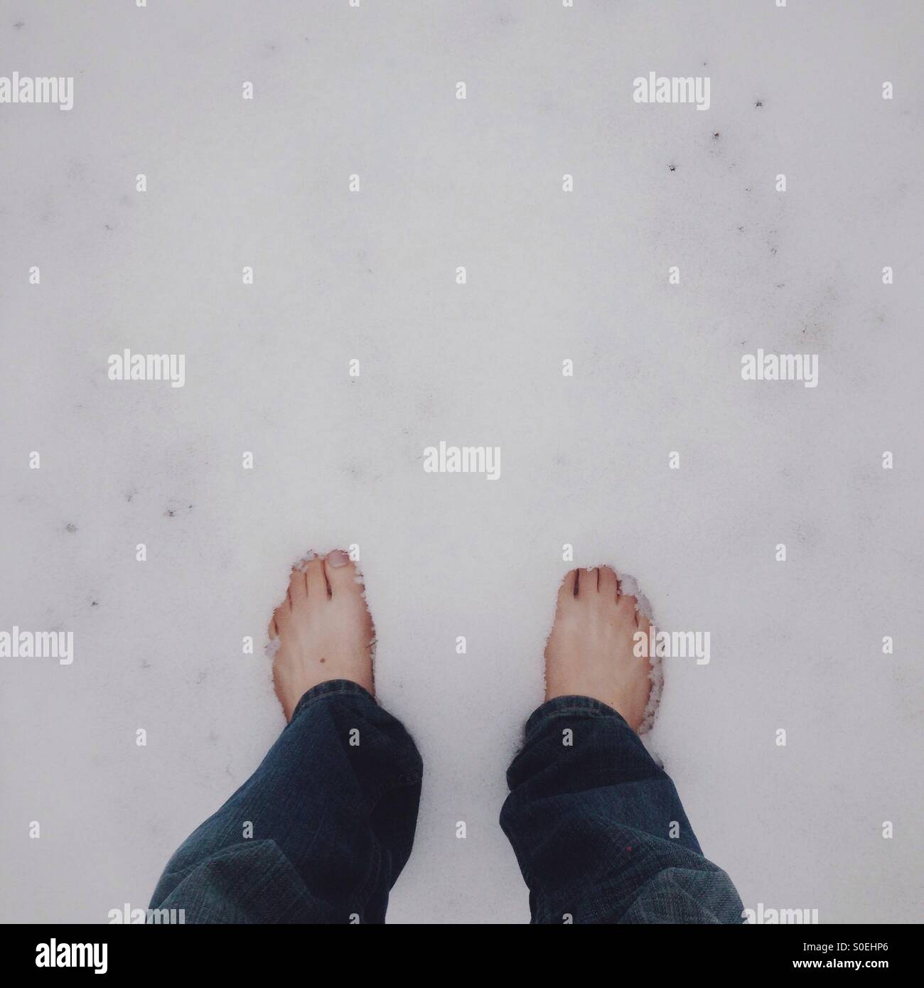 Bare feet in snow Stock Photo Alamy