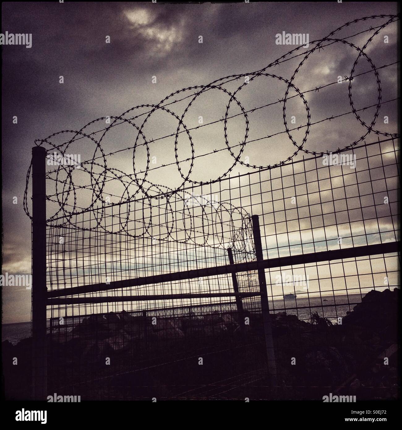 Barbed wire fence at Cape Town harbour. - Smartphone Captured Stock Image