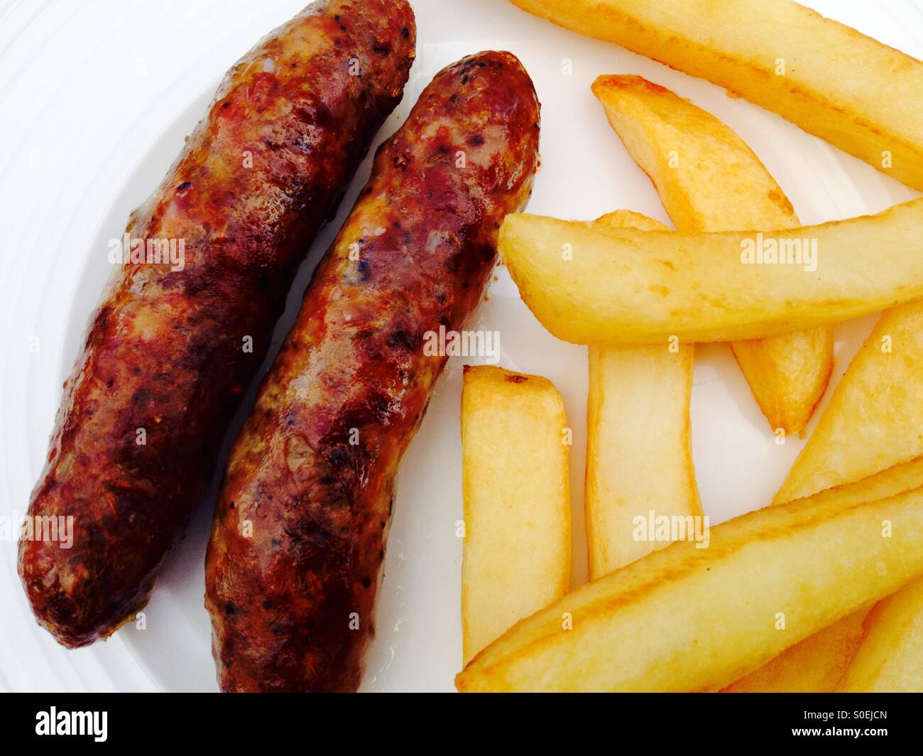 Italian fennel sausages and chips - Smartphone Captured Stock Image