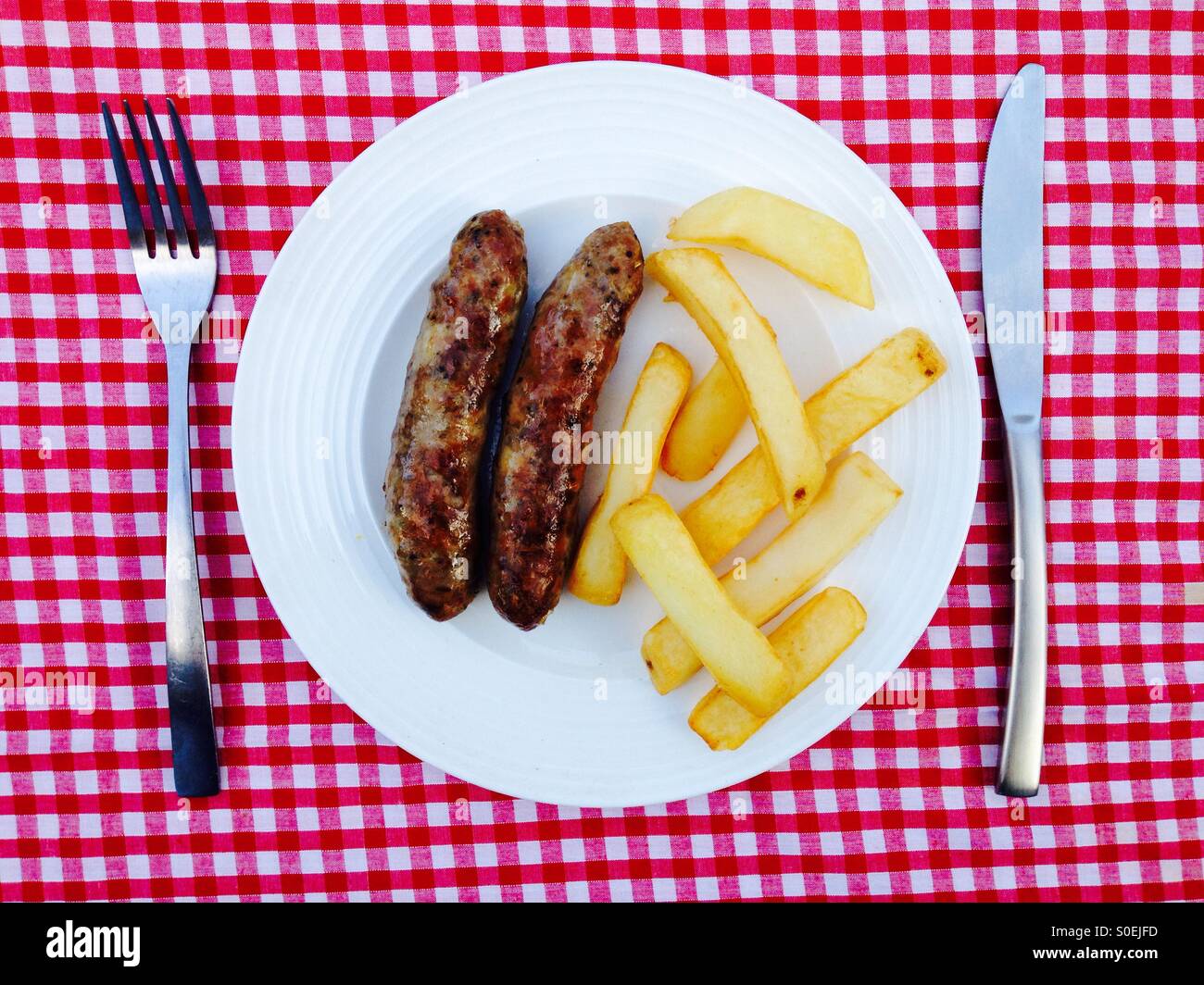 Italian fennel sausages & chips - Smartphone Captured Stock Image