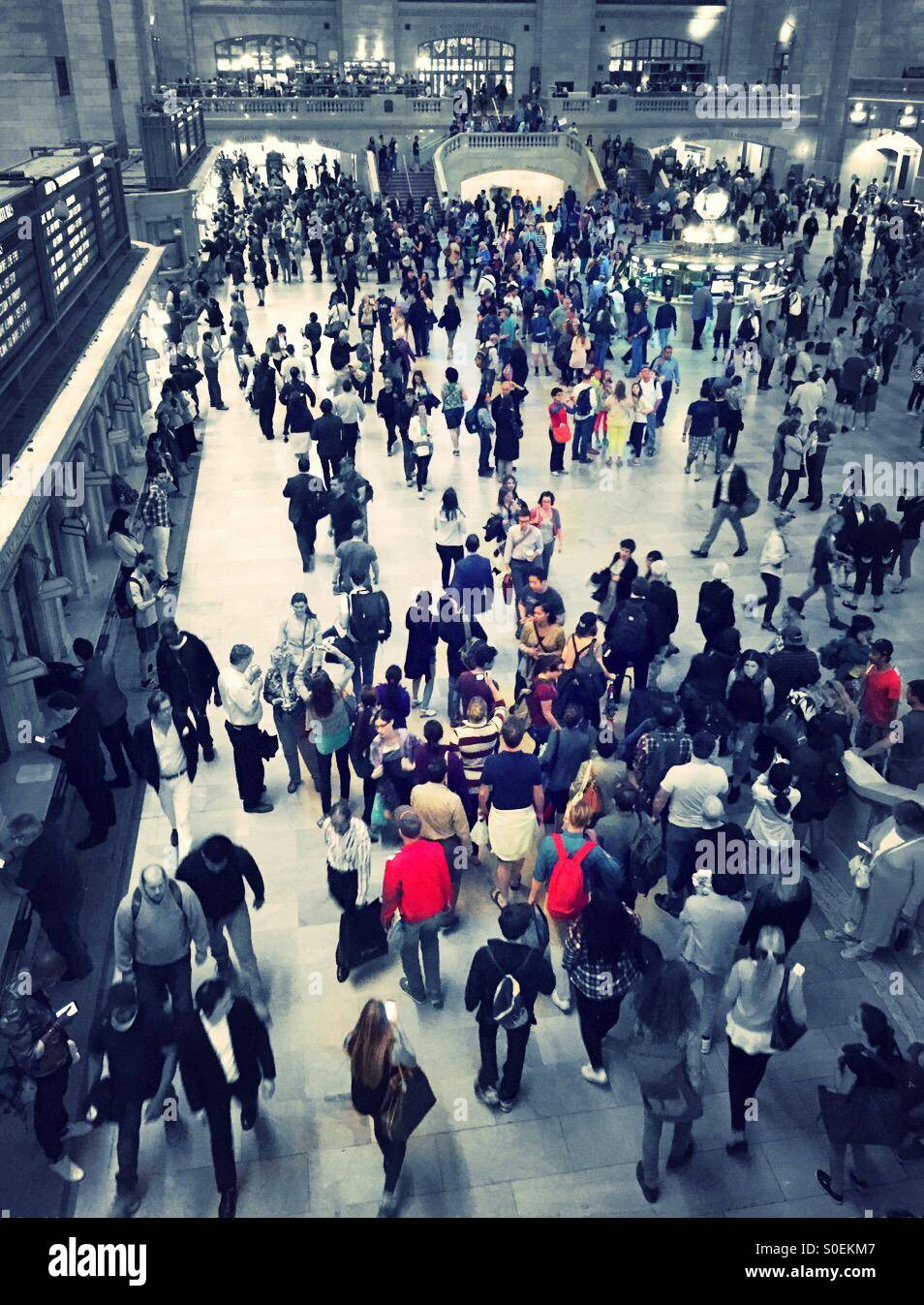 Contrasting passengers stand out in a black and white crowd GCT NYC Stock Photo