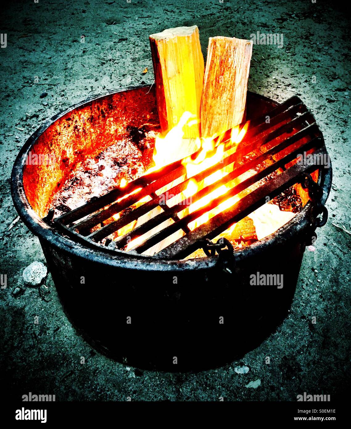 California campfire glows warmth to an evening chill. - Smartphone Captured Stock Image