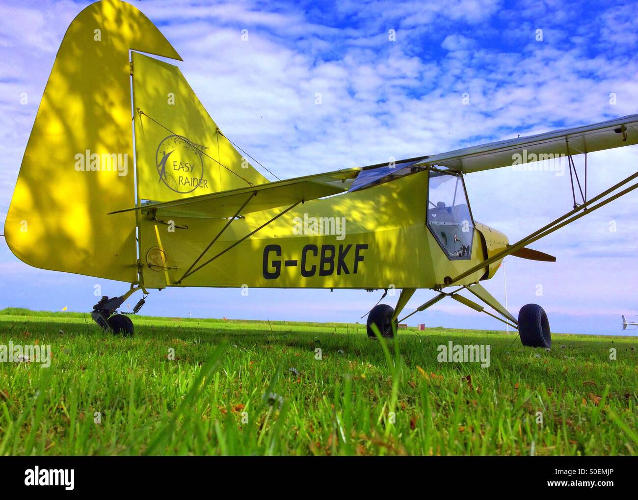 Easy Raider microlight aircraft on the grass under blue sky at North Coates Flying Club North Coates Airfield North Cotes Grimsby Stock Photo