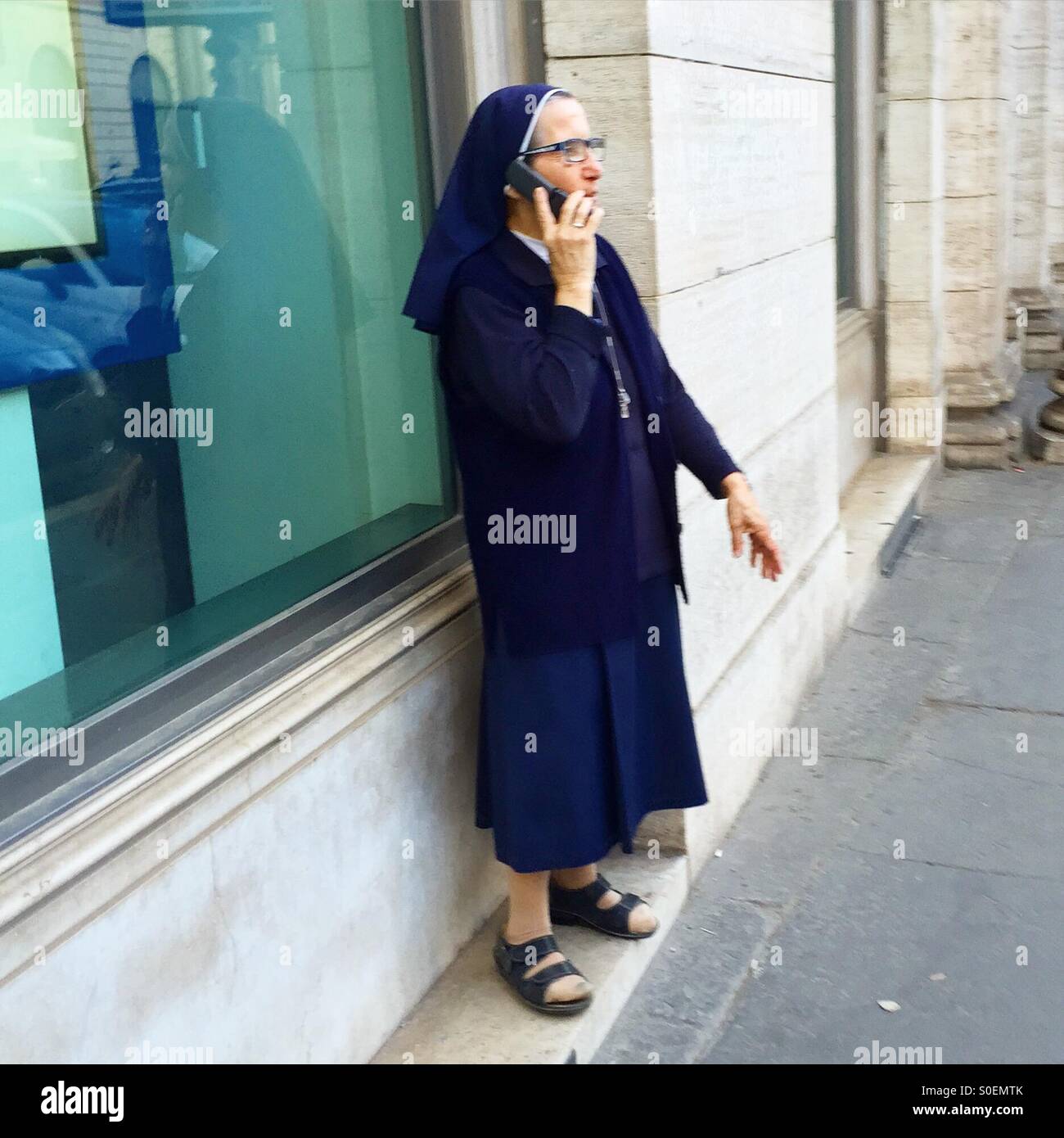 Sister on mobile phone - Smartphone Captured Stock Image