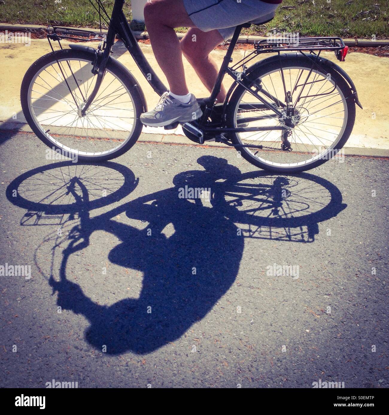Cyclist and shadow - Smartphone Captured Stock Image