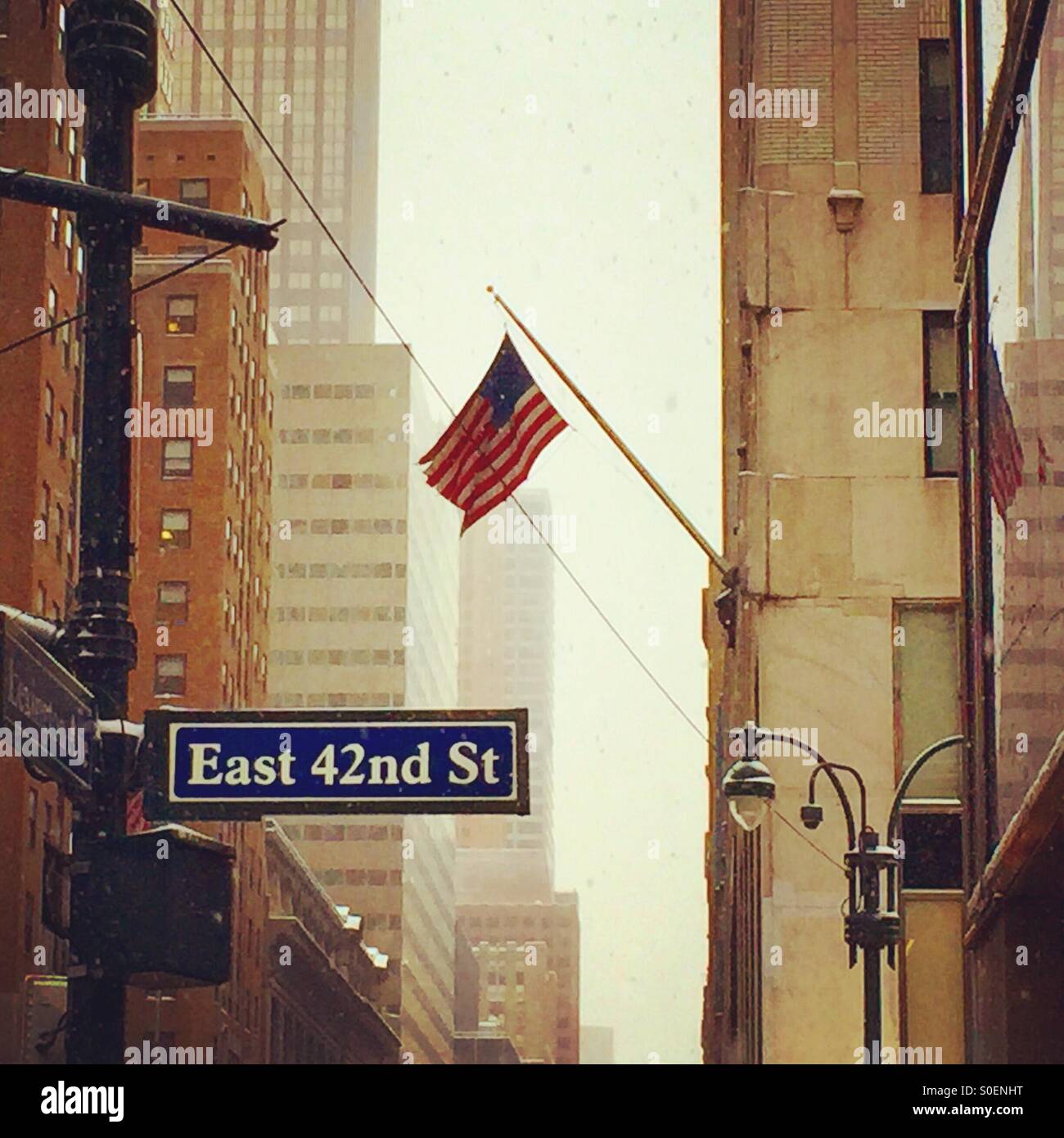 American flag hanging at East 42nd street Stock Photo